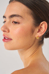 Profile view of model wearing the Oroton Como Double Studs in Worn Gold and Brass base metal with precious metal plating for Women