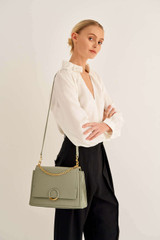 Profile view of model wearing the Oroton Elina Satchel in Shale Grey and Pebble Leather for Women