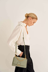 Profile view of model wearing the Oroton Elina Small Satchel in Shale Grey and Pebble Leather for Women