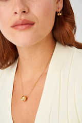 Profile view of model wearing the Oroton Arabella Necklace in Worn Gold and Brass Base With 18CT Gold Plating for Women