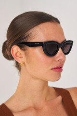 Profile view of model wearing the Oroton Lennox Sunglasses in Black and Acetate for Women