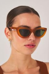 Profile view of model wearing the Oroton Lennox Sunglasses in Umber and Acetate for Women