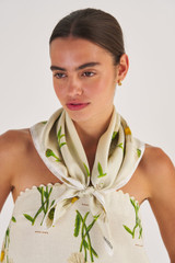 Profile view of model wearing the Oroton Field Daisy Scarf in String and 100% Silk for Women