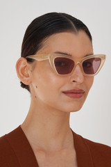 Profile view of model wearing the Oroton Kane Sunglasses in Butter and Acetate for Women