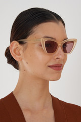 Profile view of model wearing the Oroton Kane Sunglasses in Butter and Acetate for Women