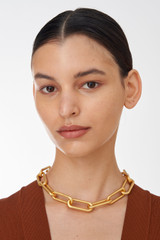 Profile view of model wearing the Oroton Hadley Necklace in Worn Gold and  for Women
