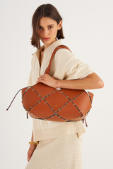 Profile view of model wearing the Oroton Lapis Small Tote in Brandy and Smooth Leather for Women