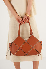 Profile view of model wearing the Oroton Lapis Small Tote in Brandy and Smooth Leather for Women