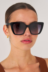 Profile view of model wearing the Oroton Jamie Sunglasses in Black and Acetate for Women