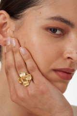 Profile view of model wearing the Oroton Aster Ring in Worn Gold and Brass Base With 18CT Gold Plating for Women