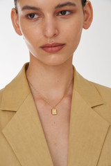 Profile view of model wearing the Oroton Fawne Rectangle Necklace in Gold/Clear and Brass Base With 18CT Gold Plating /Cubic Zirconia for Women