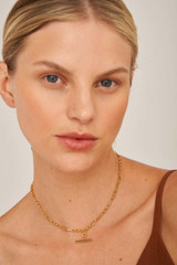 Profile view of model wearing the Oroton Inez Vintage Chain Necklace in Gold and Brass Base With 18CT Gold Plating for Women