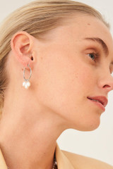 Profile view of model wearing the Oroton Farah Hoops in Silver and Brass Base With Rhodium Plating for Women