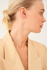 Profile view of model wearing the Oroton Farah Necklace in Gold and Brass Base With 18CT Gold Plating for Women
