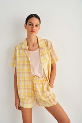 Profile view of model wearing the Oroton Check Camp Shirt in Cornsilk and 86% Cotton 14% Viscose for Women