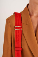 Profile view of model wearing the Oroton Heather Webbing Strap in Crimson and Polyester Webbing And Saffiano Leather Trim for Women