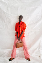 Profile view of model wearing the Oroton Drill Wide Leg Pant in Sherbet and Cotton Drill for Women