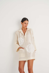 Profile view of model wearing the Oroton Doilie Tunic in Marshmallow and 100% Silk for Women