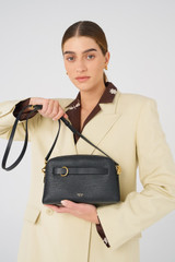 Profile view of model wearing the Oroton Audrey Crossbody in Black and Saffiano and Smooth Leather for Women