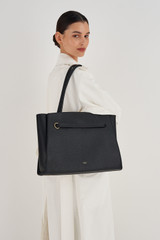 Profile view of model wearing the Oroton Audrey Large Tote in Black and Saffiano and Smooth Leather for Women
