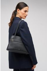 Profile view of model wearing the Oroton Audrey Small Three Pocket Day Bag in Black and Saffiano and Smooth Leather for Women