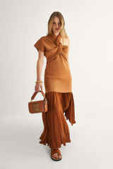 Profile view of model wearing the Oroton Asymmetric Tunic in Toffee and 77% Viscose 23% Polyester for Women