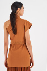 Profile view of model wearing the Oroton Asymmetric Tunic in Toffee and 77% Viscose 23% Polyester for Women