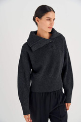 Profile view of model wearing the Oroton Button Detail Rib Collar Knit in Dark Charcoal and 100% Wool for Women