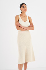 Profile view of model wearing the Oroton Crochet Skirt in Vanilla Bean and 77% Viscose, 23% Polyester for Women