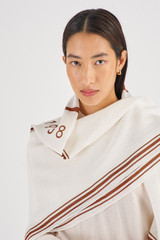 Profile view of model wearing the Oroton Eve Scarf in Cream/Cognac and 59% Linen, 41% Cotton for Women