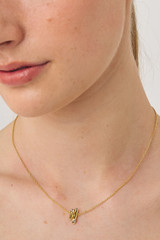 Profile view of model wearing the Oroton Giselle Necklace And Hoops Gift Set in Gold/Clear and  for Women