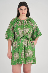 Profile view of model wearing the Oroton Full Sleeve Posie Print Dress in Garden and 100% Linen for Women