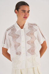 Profile view of model wearing the Oroton Geo Ric Rac Camp Shirt in White and 100% Linen for Women