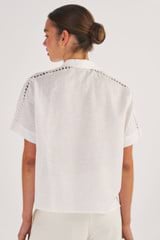 Profile view of model wearing the Oroton Geo Ric Rac Camp Shirt in White and 100% Linen for Women