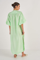 Profile view of model wearing the Oroton Column Shirt Dress in Pear and 100% Silk for Women