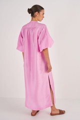Profile view of model wearing the Oroton Column Shirt Dress in Bright Foxglove and 100% Silk for Women
