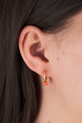 Profile view of model wearing the Oroton Keely Hoops in Gold/Coral and  for Women