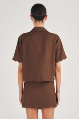 Profile view of model wearing the Oroton Cropped Scallop Camp Shirt in Dark Chocolate and 100% Linen for Women