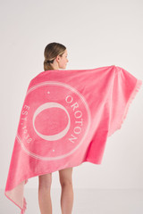 Profile view of model wearing the Oroton Kane Towel in Watermelon and 100% Woven Cotton for Women