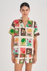 Profile view of model wearing the Oroton Flower Stamp Print Camp Shirt in String and 100% Silk for Women