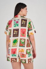 Profile view of model wearing the Oroton Flower Stamp Print Camp Shirt in String and 100% Silk for Women