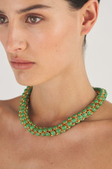 Profile view of model wearing the Oroton Arcadia Necklace in Gold/Green and Brass Base Metal With Precious Metal Plating/Reconstituted Stone for Women