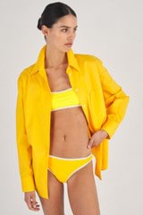Profile view of model wearing the Oroton Contrast Separate Bottom in Vibrant Yellow and 78% Recycled Nylon/ 22 % Lycra for Women