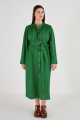 Profile view of model wearing the Oroton Stripe Shirt Dress in Kelly Green and 100% Cotton for Women