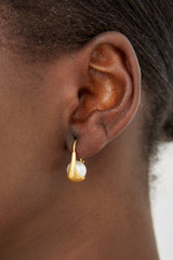 Profile view of model wearing the Oroton Jaclyn Earrings in Worn Gold/White and  for Women