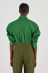 Profile view of model wearing the Oroton Stripe Shirt in Kelly Green and 100% Cotton for Women