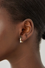 Profile view of model wearing the Oroton Jaclyn Mini Hoops in Worn Gold/White and  for Women