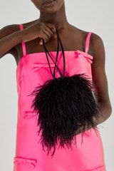 Profile view of model wearing the Oroton Grace Feather Bag in Black and Polyester Satin for Women