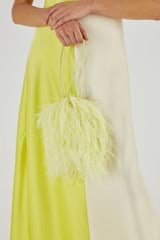 Profile view of model wearing the Oroton Grace Feather Bag in Citrine and Polyester Satin for Women