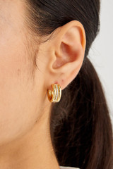 Profile view of model wearing the Oroton Lucia Hoops in Gold/Clear and  for Women